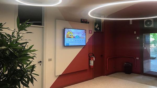 Waiting room with entrance view and promo screen