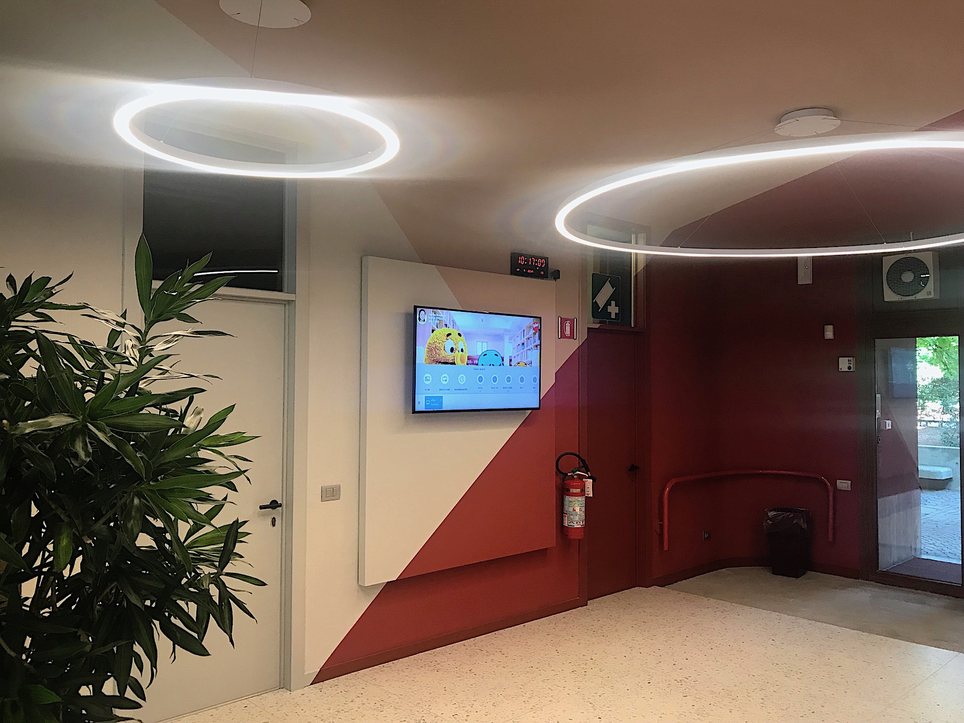 Waiting room with entrance view and promo screen